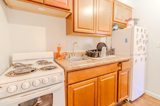5801 Lincoln Ave, Export, PA 15632 - kitchen featuring white appliances, light countertops, and light wood-style floors