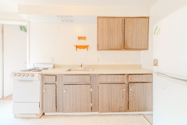 5801 Lincoln Ave, Export, PA 15632 - kitchen with white appliances, light brown cabinets, and light countertops