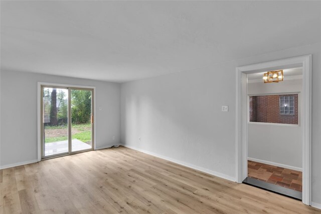 494 Highview Rd, Baldwin Twp, PA 15228 - empty room featuring wood finished floors and a chandelier