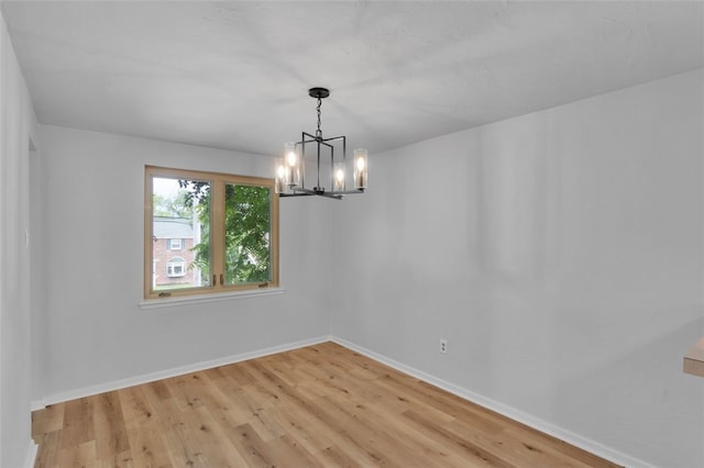494 Highview Rd, Baldwin Twp, PA 15228 - unfurnished room with a chandelier and light wood finished floors