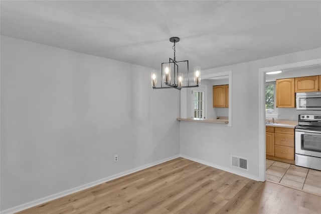 494 Highview Rd, Baldwin Twp, PA 15228 - unfurnished dining area with a chandelier and light wood-style flooring