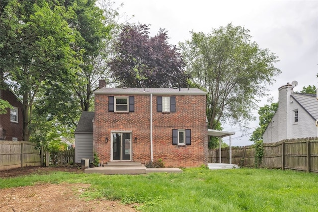 494 Highview Rd, Baldwin Twp, PA 15228 - rear view of house with brick siding, a chimney, and a fenced backyard