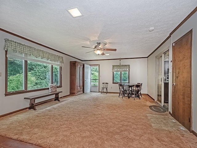 2665 Warrendale Bayne Rd, Marshall, PA 15005 - living area with ornamental molding, a ceiling fan, plenty of natural light, a textured ceiling, and light carpet