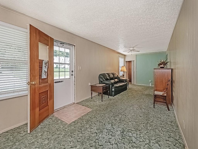 2665 Warrendale Bayne Rd, Marshall, PA 15005 - carpeted entryway with a textured ceiling, ceiling fan, and crown molding