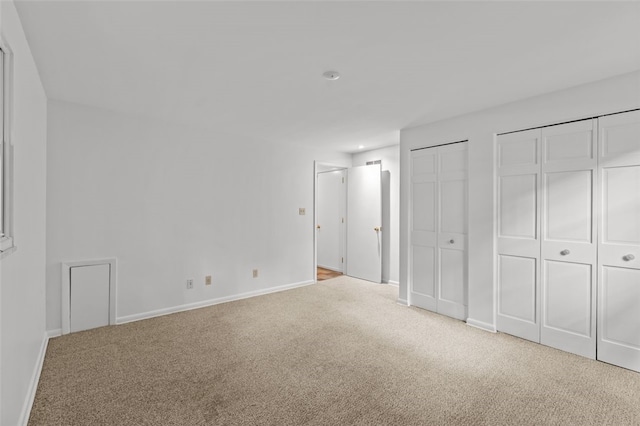 103 Drood Ln, Ross Twp, PA 15237 - unfurnished bedroom featuring multiple closets and carpet