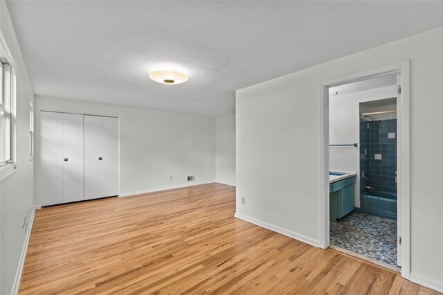 103 Drood Ln, Ross Twp, PA 15237 - unfurnished bedroom with light wood-style floors, ensuite bath, and a closet