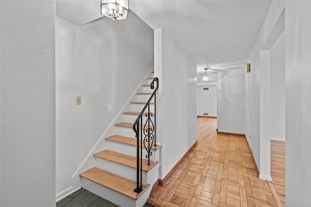 103 Drood Ln, Ross Twp, PA 15237 - stairs featuring a chandelier