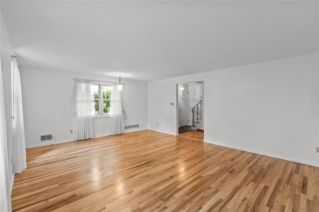 103 Drood Ln, Ross Twp, PA 15237 - empty room featuring stairs and light wood-type flooring
