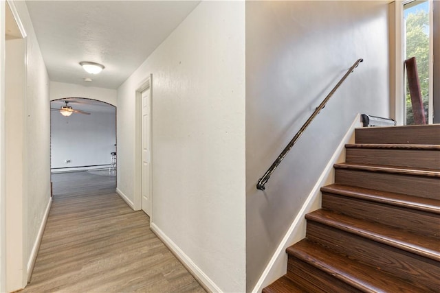 130 Clare Dr, South Strabane, PA 15301 - stairway with wood finished floors, a baseboard heating unit, and ceiling fan