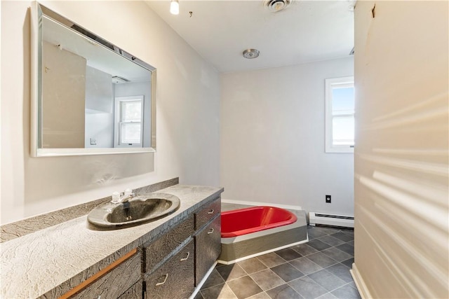 130 Clare Dr, South Strabane, PA 15301 - bathroom featuring baseboard heating, vanity, and tile patterned floors