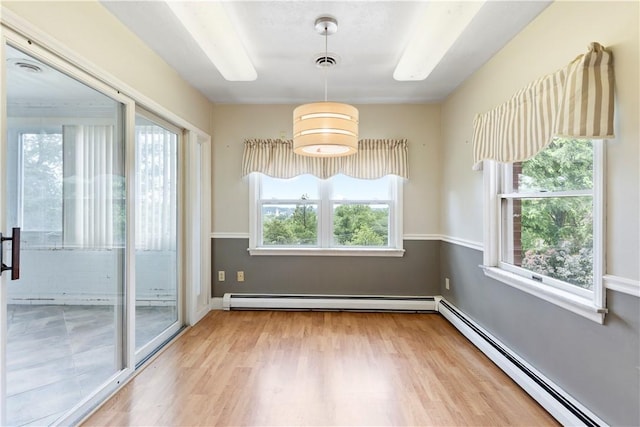 130 Clare Dr, South Strabane, PA 15301 - unfurnished room featuring a baseboard radiator, a baseboard heating unit, and wood finished floors