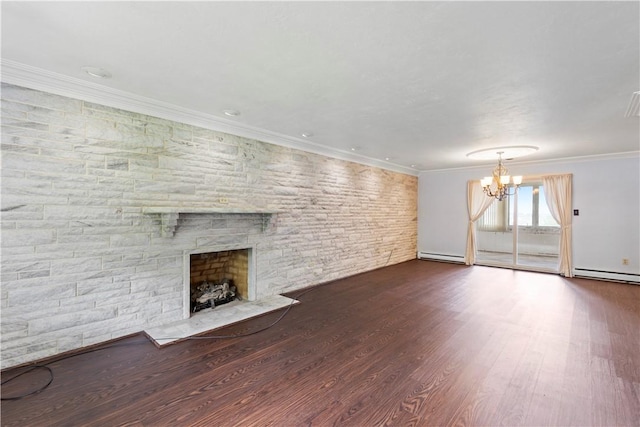 130 Clare Dr, South Strabane, PA 15301 - unfurnished living room featuring a chandelier, a stone fireplace, a baseboard radiator, wood finished floors, and crown molding