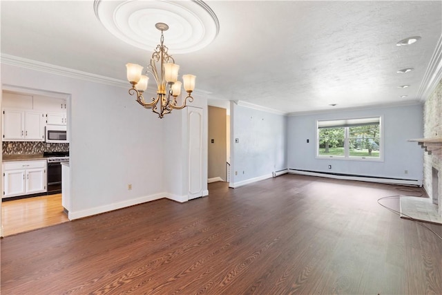 130 Clare Dr, South Strabane, PA 15301 - unfurnished living room featuring a baseboard radiator, a chandelier, dark wood-style flooring, ornamental molding, and a fireplace with flush hearth