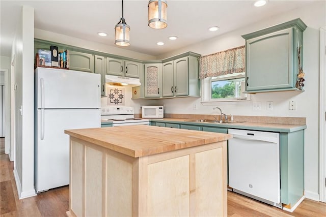 135 Preacher Rd, East Huntingdon, PA 15639 - kitchen featuring white appliances, under cabinet range hood, green cabinetry, light wood-style floors, and recessed lighting