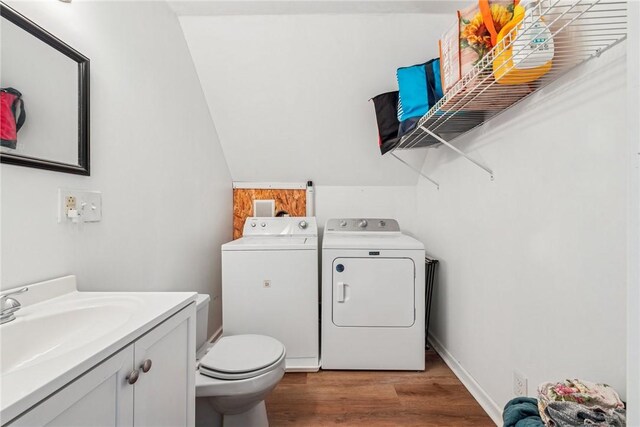135 Preacher Rd, East Huntingdon, PA 15639 - bathroom with washer and clothes dryer, wood finished floors, and vanity