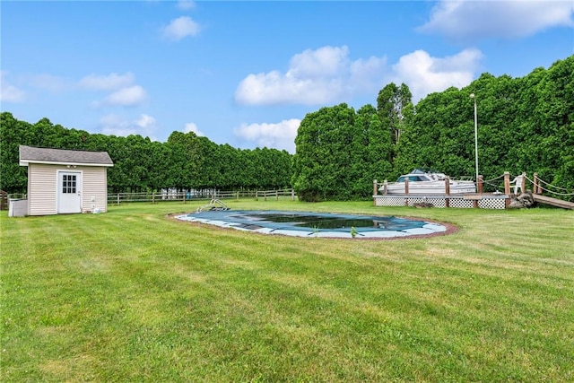 135 Preacher Rd, East Huntingdon, PA 15639 - view of yard with a wooden deck, a covered pool, and a shed