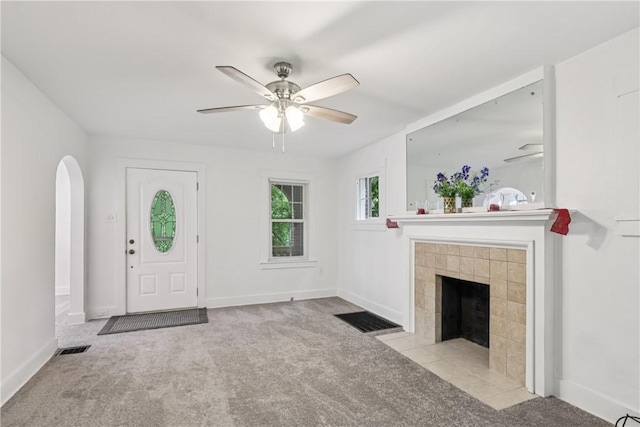 1571 Baldwick Rd, Banksville/Westwood, PA 15205 - entryway with carpet floors, ceiling fan, a tile fireplace, and arched walkways