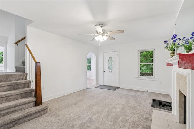 1571 Baldwick Rd, Banksville/Westwood, PA 15205 - entryway with healthy amount of natural light, a tile fireplace, ceiling fan, and stairs
