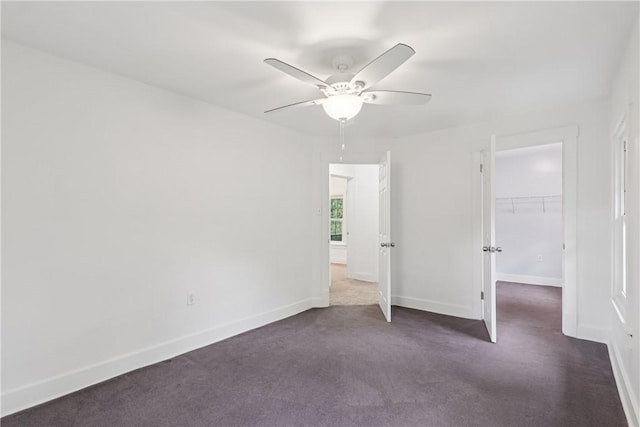 1571 Baldwick Rd, Banksville/Westwood, PA 15205 - unfurnished bedroom featuring dark carpet, a walk in closet, a closet, and ceiling fan