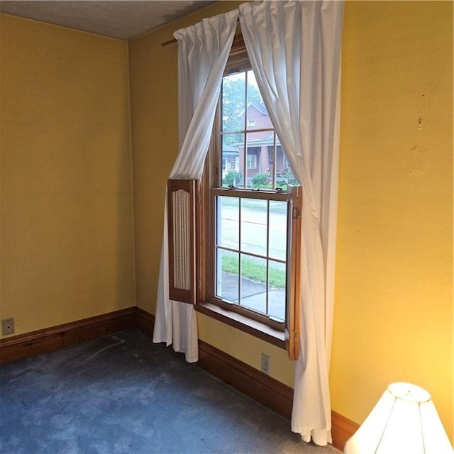 111 Laughlin St, Dawson, PA 15428 - unfurnished room with dark colored carpet and plenty of natural light