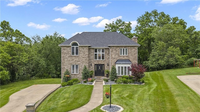 1008 Aspen Dr, Findlay Twp, PA 15126 - view of front of house featuring a front lawn and a chimney