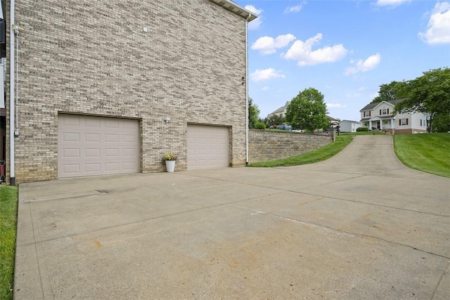 1008 Aspen Dr, Findlay Twp, PA 15126 - view of side of property with driveway, brick siding, and a residential view
