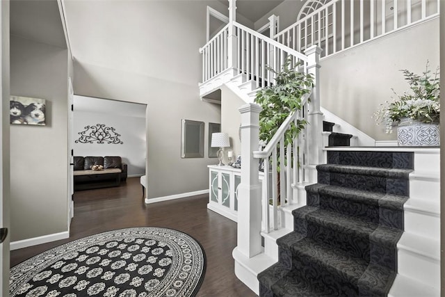 1008 Aspen Dr, Findlay Twp, PA 15126 - staircase featuring wood finished floors and a towering ceiling