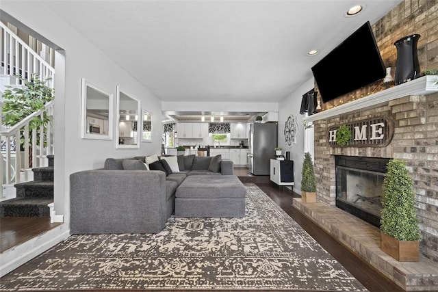 1008 Aspen Dr, Findlay Twp, PA 15126 - living area with a fireplace, dark wood-type flooring, stairs, and recessed lighting