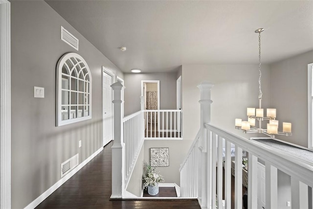 1008 Aspen Dr, Findlay Twp, PA 15126 - corridor with a chandelier, wood finished floors, and an upstairs landing