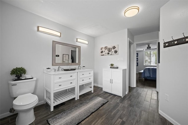1008 Aspen Dr, Findlay Twp, PA 15126 - ensuite bathroom with wood finished floors, double vanity, and a ceiling fan