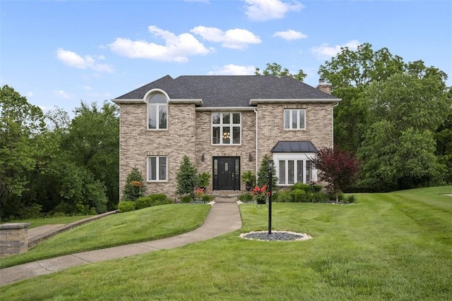 1008 Aspen Dr, Findlay Twp, PA 15126 - view of front of home featuring a chimney, a front lawn, and brick siding