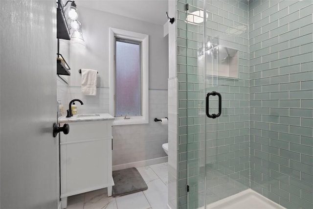 36 Warriors Rd, Green Tree, PA 15205 - bathroom with marble finish flooring, vanity, tile walls, a shower stall, and a wainscoted wall