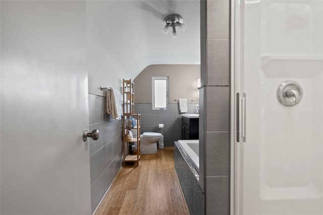 36 Warriors Rd, Green Tree, PA 15205 - bathroom featuring tile walls, a shower, wood finished floors, vanity, and a wainscoted wall