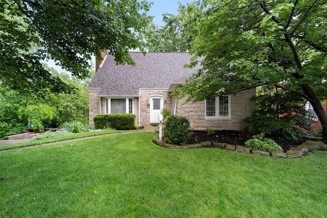 36 Warriors Rd, Green Tree, PA 15205 - view of front of home featuring stone siding, a chimney, a front yard, and roof with shingles