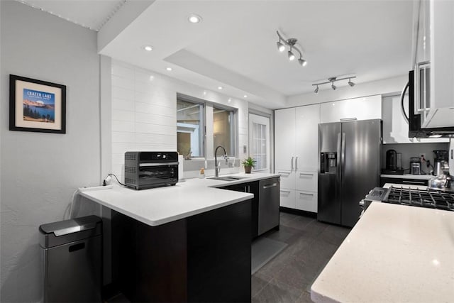 36 Warriors Rd, Green Tree, PA 15205 - kitchen featuring appliances with stainless steel finishes, white cabinetry, light countertops, a peninsula, and modern cabinets