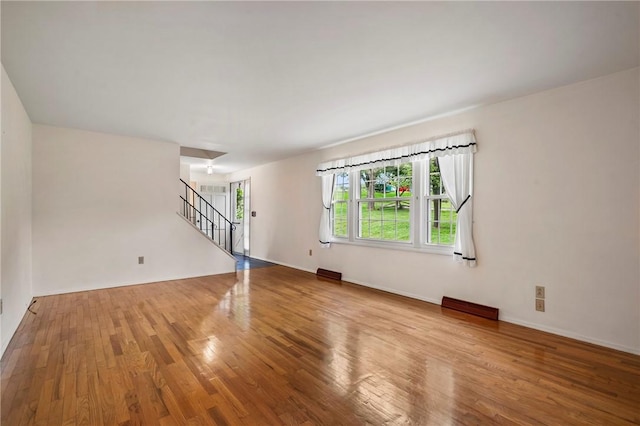 100 Laurel Hill Dr, Pine Twp Nal, PA 15090 - unfurnished living room with wood finished floors and stairway