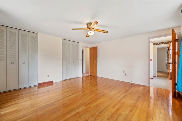 100 Laurel Hill Dr, Pine Twp Nal, PA 15090 - unfurnished bedroom with light wood-type flooring, multiple closets, and ceiling fan