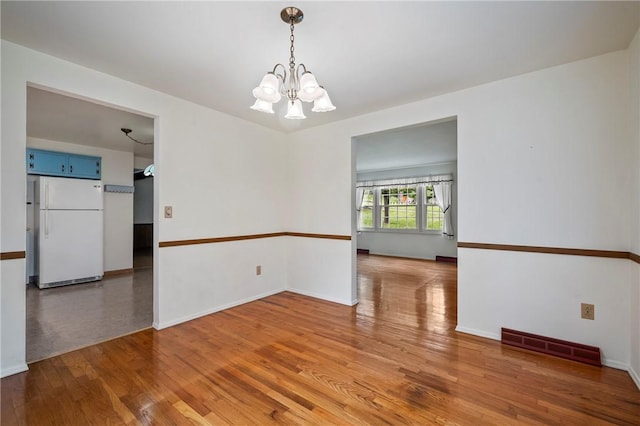 100 Laurel Hill Dr, Pine Twp Nal, PA 15090 - unfurnished room with a chandelier and light wood-style floors