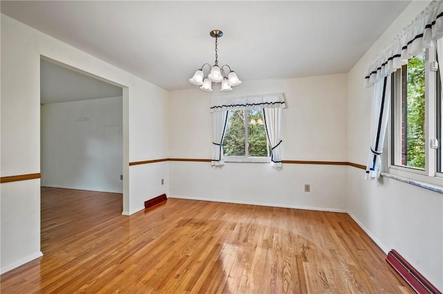 100 Laurel Hill Dr, Pine Twp Nal, PA 15090 - spare room featuring a baseboard heating unit, a chandelier, and light wood finished floors