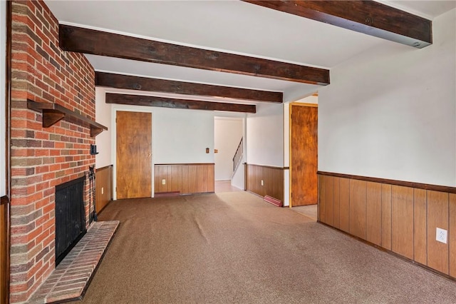 100 Laurel Hill Dr, Pine Twp Nal, PA 15090 - unfurnished living room with wainscoting, beamed ceiling, stairs, wooden walls, and a fireplace