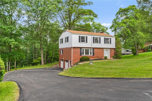 100 Laurel Hill Dr, Pine Twp Nal, PA 15090 - colonial-style house with brick siding, driveway, a garage, a chimney, and a front yard