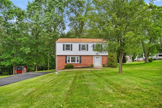 100 Laurel Hill Dr, Pine Twp Nal, PA 15090 - colonial house with brick siding, a front yard, asphalt driveway, and entry steps