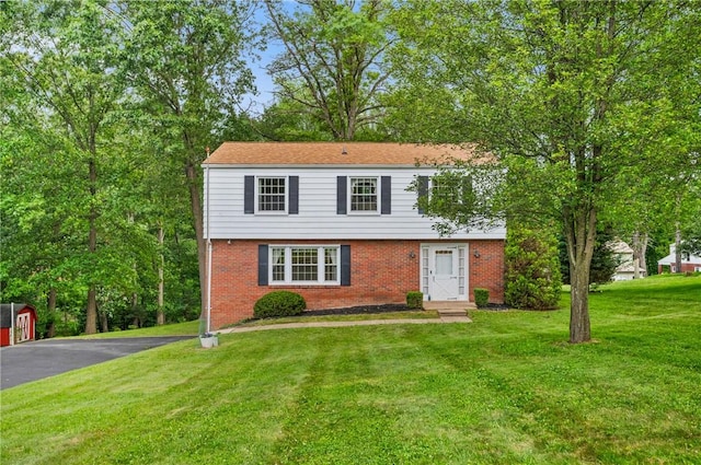 100 Laurel Hill Dr, Pine Twp Nal, PA 15090 - colonial inspired home with brick siding, a front yard, and asphalt driveway