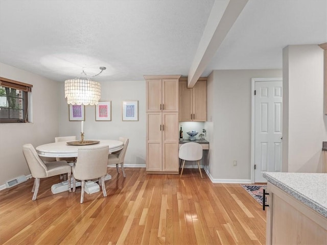 212 Timber Ln, Aleppo, PA 15143 - dining room featuring light wood finished floors, a chandelier, and a textured ceiling