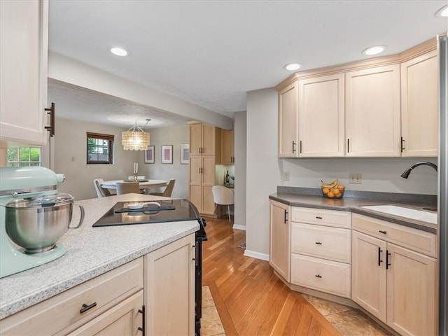 212 Timber Ln, Aleppo Nal, PA 15143 - kitchen featuring black range with electric stovetop, light brown cabinetry, light wood-style flooring, recessed lighting, and hanging light fixtures
