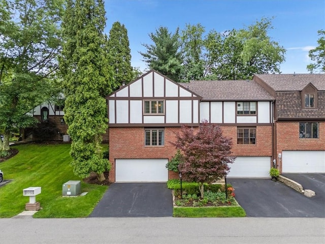 212 Timber Ln, Aleppo Nal, PA 15143 - view of front of home featuring driveway, brick siding, and a garage