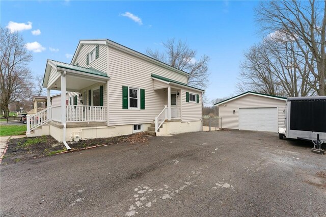 624 S Darby Rd, Hermitage, PA 16148 - view of front of property with an outdoor structure, a detached garage, a porch, and asphalt driveway