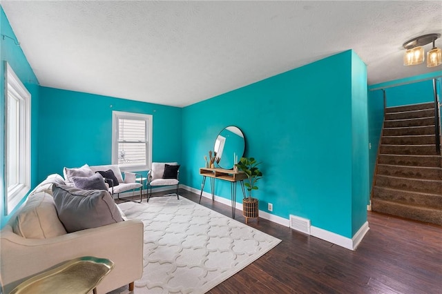 624 S Darby Rd, Hermitage, PA 16148 - living area with wood finished floors, a textured ceiling, and stairs