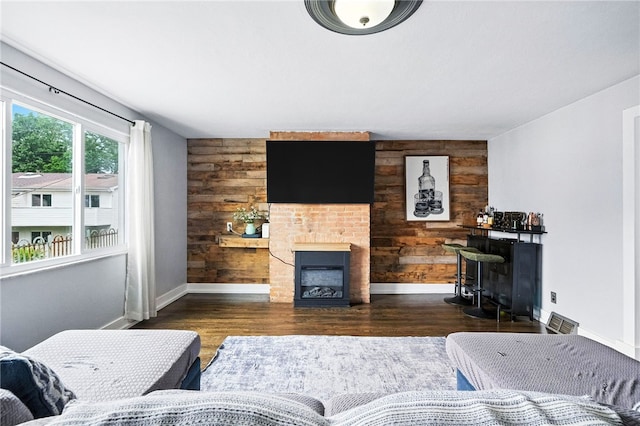 2740 Shelly St, South Side, PA 15203 - living room with a fireplace, wood walls, and wood finished floors