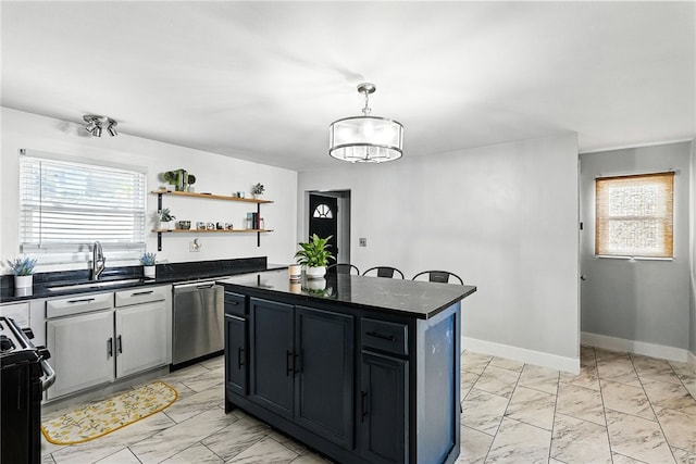 2740 Shelly St, South Side, PA 15203 - kitchen featuring stainless steel dishwasher, gas range, light marble finish floors, and dark countertops